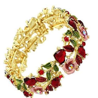Gifts 4 All, Beautiful bracelet features crystals and enameled leaves and flower. adjustable wraps around and fits in your arm. makes it easier to wear. Gold tone bracelet.
Makes great gift. Wear it yourself or give as a gift.