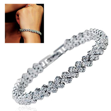 Gifts 4 All, Beautiful bracelet has dazzling crystals over silver tone metal. Very pretty. Watch buckle makes it easy to wear.