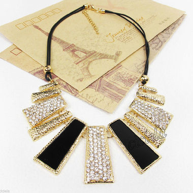 Gifts 4 All, 
Very pretty necklace features choker necklace gold tone and black tone with crystals. Attached to black cord. Extension 2"
Material:Crystal
Colors:Golden + Black + Silver
Total Length:app 21.25"
Extension Chain Length:app 2"
Pendant Size:app 4.5" (L) x 1.4 (W) 