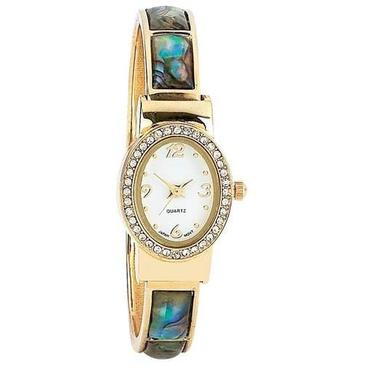 Gifts 4 All, Features Japan quartz movement, gold-tone band with faux mother-of-pearl inlays, white face surrounded by crystals, and velveteen pouch. Limited 1 year warranty. Not intended for children under 13 years of age.
