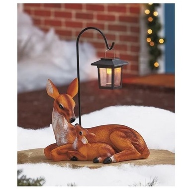 Gifts 4 All, Create an adorable scene in your garden with this Solar Deer Family Statue. It depicts a mother deer and her fawn nuzzling under a solar-powered lantern. The mission-style lantern (3" sq. x 4-1/2"H) hangs from the included 12" long shepherd's hook. It turns on automatically after dark and also has an on/off switch. Deer, 11-1/2"W x 6-3/4"D x 8-3/4"H. Cold cast ceramic and metal.

Sweet and sentimental yard decor!
Lantern lights up at dusk
Details:
Deer, 11-1/2"W x 6-3/4"D x 8-3/4"H
Shepherd's hook, 12"L
Lantern, 3" sq. x 4-1/2"H
Cold cast ceramic and metal
Solar powered 
