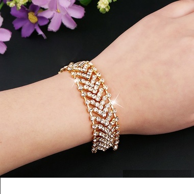 Gifts 4 All, Beautiful bracelet has dazzling crystals over silver tone or gold tone metal. Very pretty. Fish hook. 