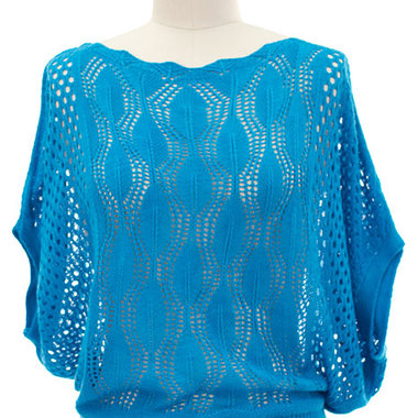 Gifts 4 All, A Lace Knit top featuring a leaf pattern knit. Pointelle knitwear. Relaxed fit bodice and short dolmen sleeves. Solid ribbed trimming. Boat neckline. Semi-sheer. Medium in weight. 
Available Sizes: S/M or L/XL
Available Colors: Turquoise, Coral, Black or Cream
Fabric:	Yarn
Content:	60% Acrylic 40% Nylon
