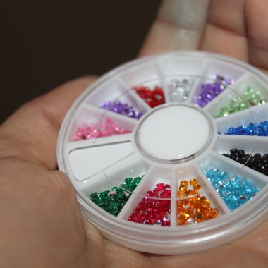 Gifts 4 All, This nail art kit is the perfect accessory! Fun and easy to apply, simply paint your nails the color of your choice, apply the crystals or fruits and cover with a clear top coat. Each plastic wheel has 12 different nail accents in individual compartments.  144-pc. Your choice of sliced fruit and plastic crystals.
 