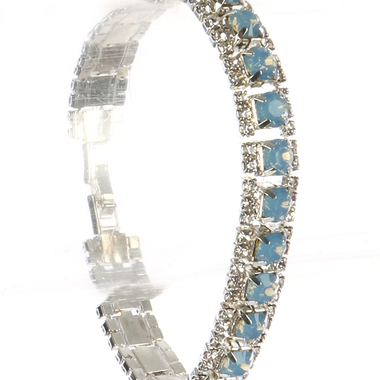 Gifts 4 All, Beautiful crystal bracelet having 3 rows of crystals. Middle layer is colored crystal and side rows have clear crystals. 7 1/2" Long and 1/3" tall. It has fold over clasps. 