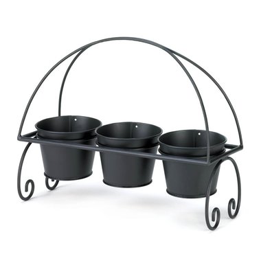 Gifts 4 All,  PS: Plants not included.
Adding cheer to your living space is as easy as 1-2-3! This adorable 3 planters feature three black metal planter pots that nestle into a scrolling black metal frame. Perfect for your patio table, porch, or anywhere you could use a triple dose of greenery. Plant your favorite blooms and enjoy!
Item Size - 15" x 5 1/8" x 11 3/4" high; each planter: 4 5/8" diameter x 3 1/2" high.