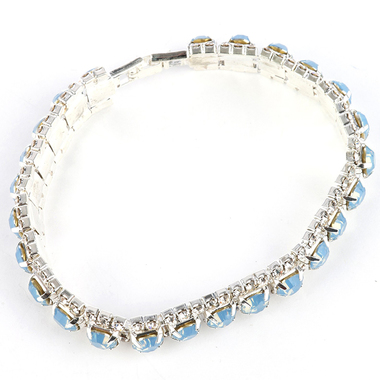 Gifts 4 All, Beautiful crystal bracelet having 3 rows of crystals. Middle layer is colored crystal and side rows have clear crystals. 7 1/2" Long and 1/3" tall. It has fold over clasps. 