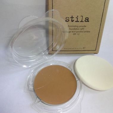 Gifts 4 All, Stila illuminating powder foundation Refill
Shade: 80 Watt
Size: 10g / 0.35oz
Illuminate your face to bring out its beauty with the Stila Illuminating Powder Foundation. Formulated with tiny crystals of Mica, this makeup powder will make your skin radiate with freshness. The Stila Illuminating Powder diminishes skin imperfections and brings forth an ageless glowing skin. This makeup powder is fortified with SPF 12 so it is a good choice for daytime wear as well. Applying this Stila foundation is easy and it is also perfect to take along for easy touch ups on the go. You can apply this Stila foundation dry when you need a light coverage, or with a damp sponge for a complete coverage. You can use a makeup brush for a sheer finish with the Stila Illuminating Powder that is perfect for all skin types.

BRAND NEW ~ NEVER USED ~ IN ORIGINAL BOX
Comes in a sealed clamshell with sponge applicator. Can be used with or without a compact